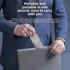 Person in a suit holding a gray laptop bag with text about its portability.