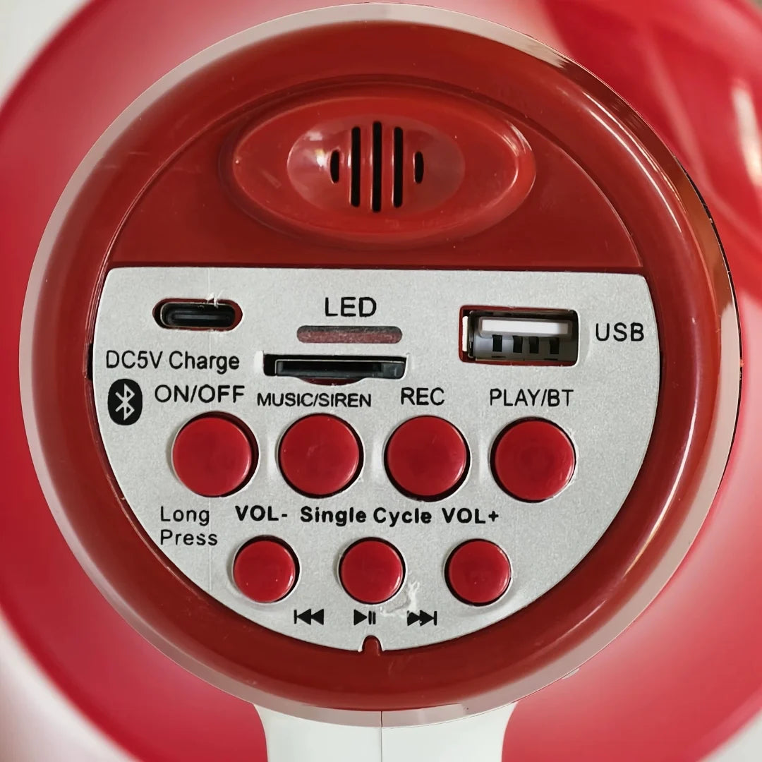 Close-up of a red electronic device with control buttons and ports on a white background