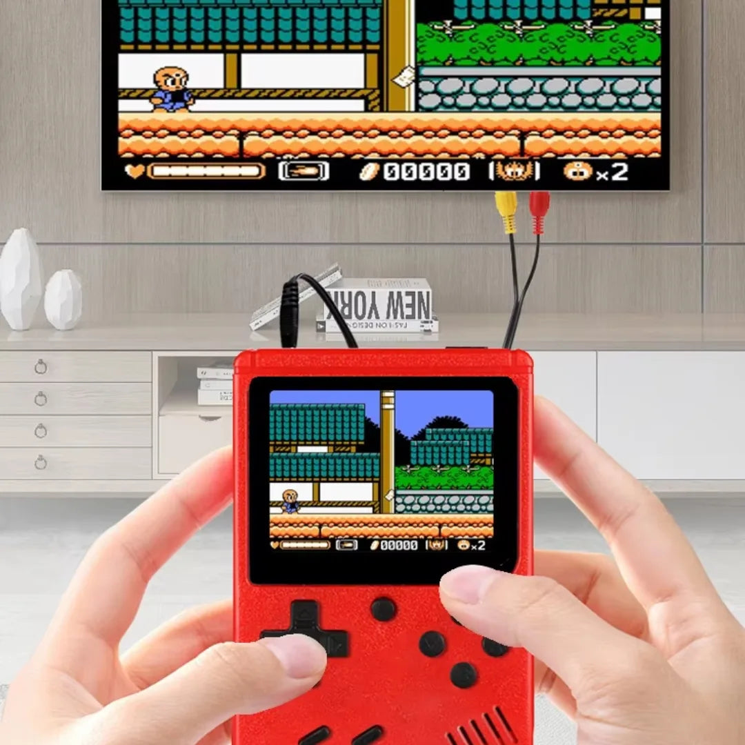 Handheld gaming console displaying a classic game with a TV in the background.