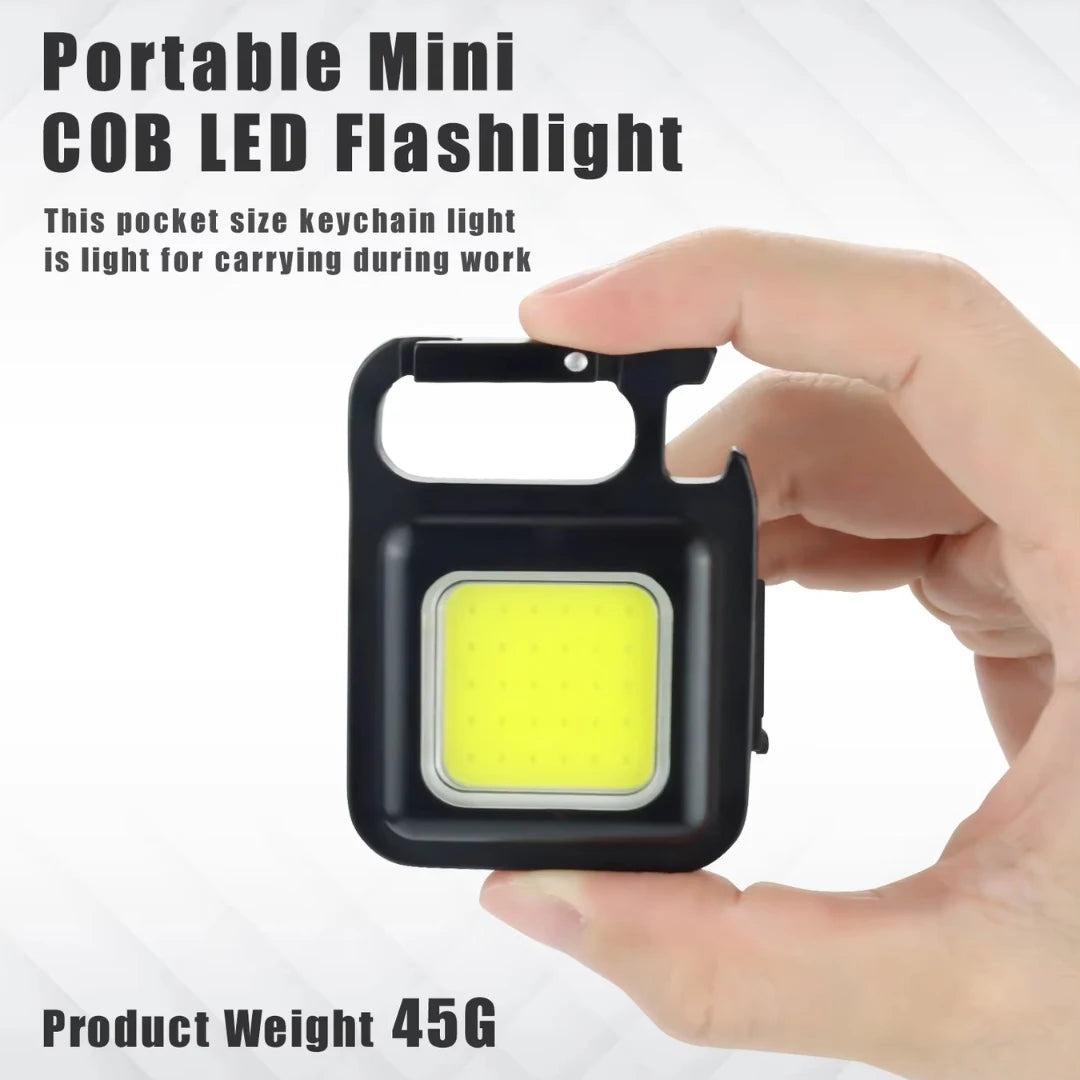 Hand holding a portable mini COB LED flashlight with text on a white background