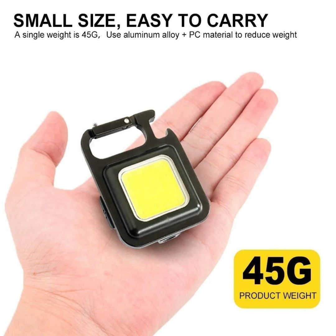 Small light device held in a hand with text about weight and material