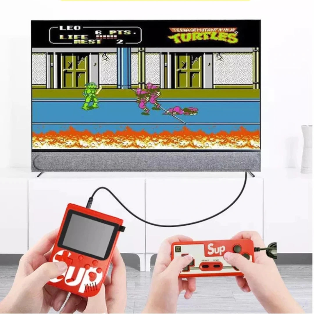 Two hands holding red handheld gaming consoles with a screen displaying a 'Teenage Mutant Ninja Turtles' video game.