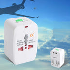Travel universal adapter with CE marking against a sky background