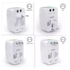 Four views of a white travel adapter with different socket types labeled for Europe, UK, US, and Australia/New Zealand.